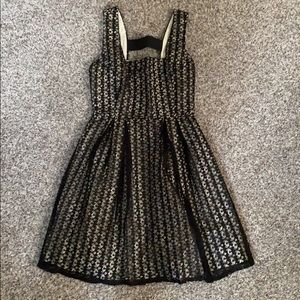 Classy black lace over beige background